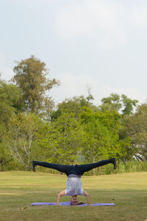 Young beautiful woman exercising at the park outdoors