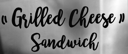 Grilled Cheese Sandwich sign against gray background