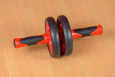 Portrait of ab wheel on wooden floor