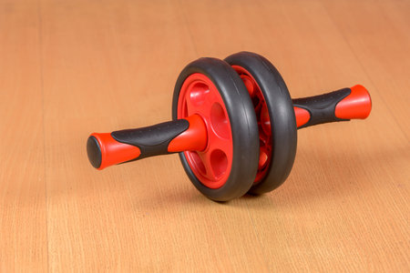 Portrait of ab wheel on wooden floor