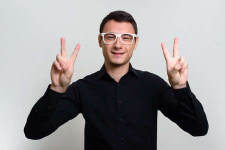 Portrait of handsome businessman against white backgroundの写真素材