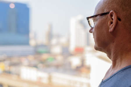 Senior handsome Scandinavian man inside the room by the windowの写真素材