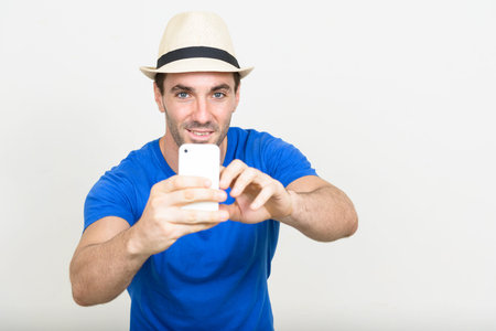 Portrait of handsome Hispanic tourist man ready for vacation