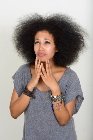 Portrait of young beautiful African woman with Afro hair