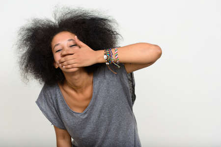 Portrait of young beautiful African woman with Afro hairの写真素材