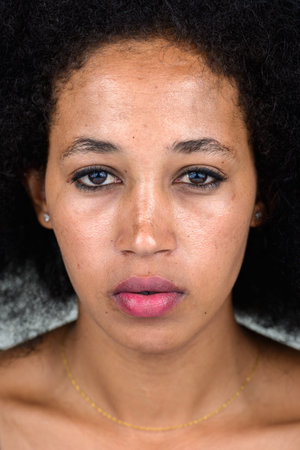Portrait of young beautiful African woman with Afro hair