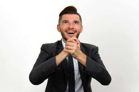 Portrait of handsome bearded Hispanic businessman in suitの写真素材