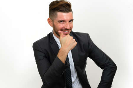 Portrait of handsome bearded Hispanic businessman in suitの写真素材