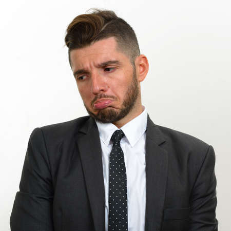 Portrait of handsome bearded Hispanic businessman in suitの写真素材