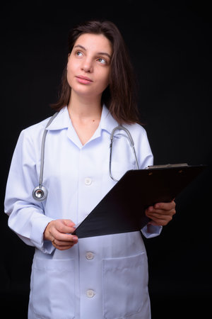 Portrait of young beautiful woman doctor with short hair