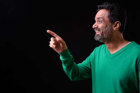 Portrait of mature bearded Indian man with curly hairの写真素材