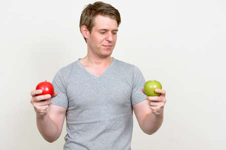 Portrait of young handsome man ready for gymの写真素材