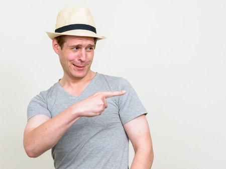 Portrait of young handsome tourist man ready for vacation