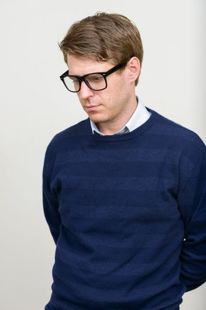 Portrait of young handsome man with blond hair