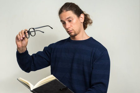 Portrait of handsome bearded man with long hair