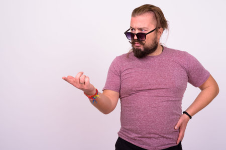 Bearded man with mustache and long hair against white background