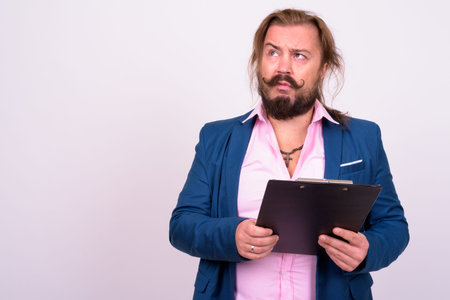 Bearded businessman with mustache and long hair against white background