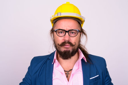 Bearded businessman with hardhat against white background