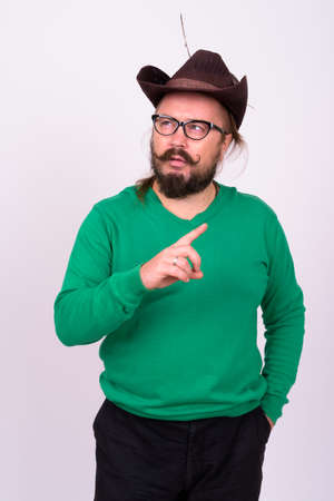 Bearded man with mustache and long hair against white backgroundの写真素材