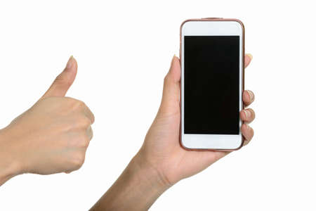Portrait of hand holding smart phone and giving thumbs upの写真素材