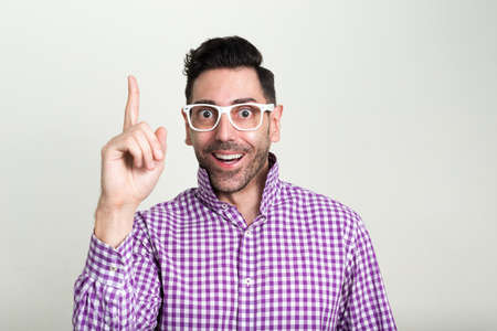 Portrait of happy handsome bearded hipster man with eyeglassesの写真素材