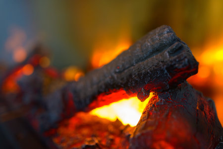 Portrait of hot smoldering charcoals burning in flames