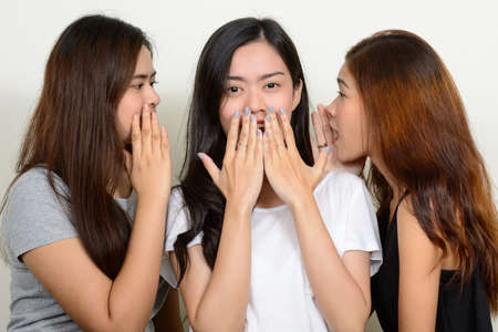 Portrait of three young Asian women as friends togetherの写真素材