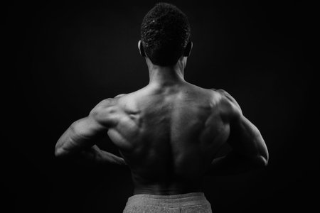 Portrait of young muscular African man shirtless in black and white