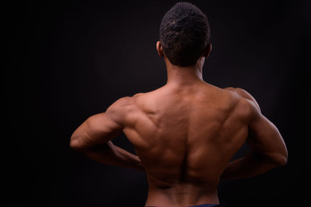Portrait of young handsome muscular African man shirtless