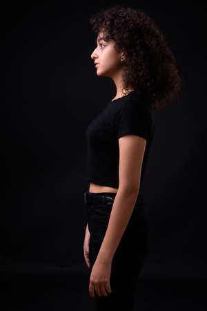 Portrait of young beautiful Persian teenage girl with curly hairの写真素材