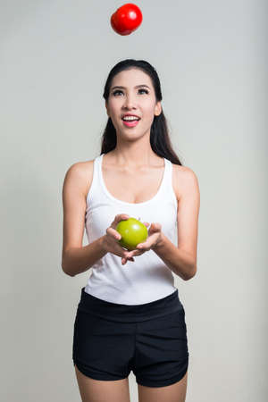 Portrait of happy young beautiful Asian woman ready for gymの写真素材