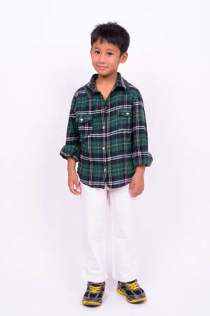 Studio shot of cute Asian boy against white backgroundの写真素材