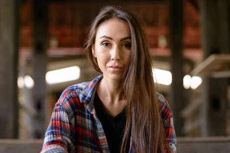 Portrait of young beautiful hipster woman in the city streetsの写真素材