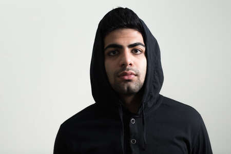 Portrait of young handsome bearded Indian manの写真素材