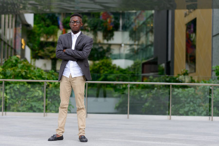 Young African businessman in the city outdoors