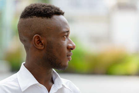 Young African businessman in the city outdoorsの写真素材
