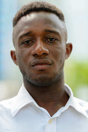 Young African businessman in the city outdoorsの写真素材