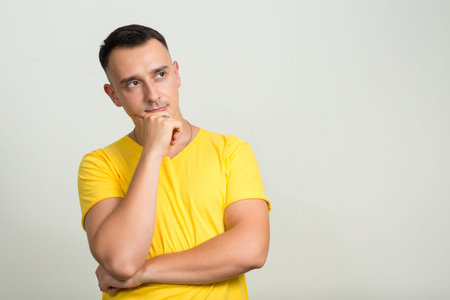 Portrait of handsome man with yellow shirt