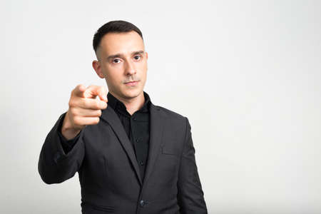 Portrait of handsome businessman in suit against white backgroundの写真素材