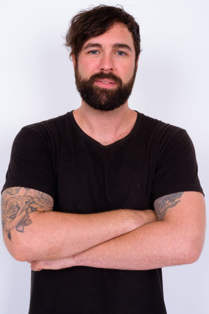 Portrait of handsome bearded man against white background