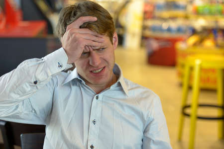 Handsome Scandinavian businessman with blond hair indoorsの写真素材