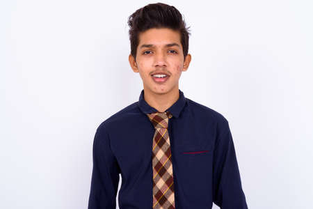 Portrait of young handsome Indian teenage boy as businessmanの写真素材