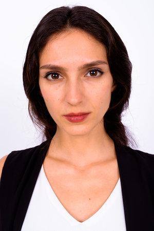 Portrait of young beautiful businesswoman against white background