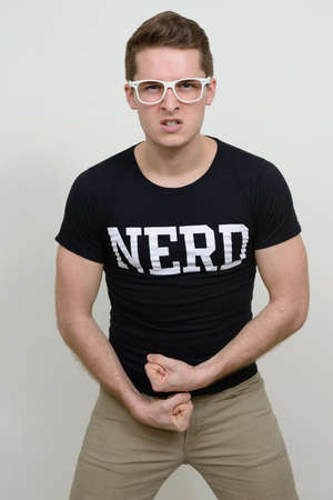 Portrait of young handsome nerd man with eyeglassesの写真素材