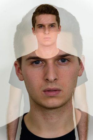 Portrait of young handsome man with multiple exposure effect