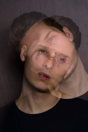 Portrait of young handsome man with multiple exposure effect