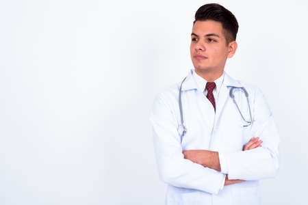 Portrait of young handsome multi ethnic man doctorの写真素材
