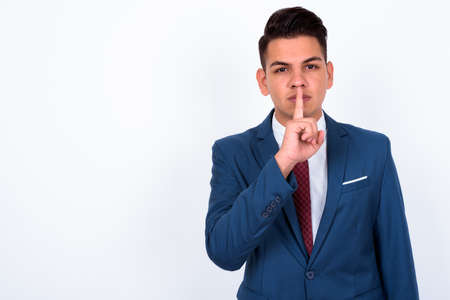 Portrait of young handsome multi ethnic businessman in suitの写真素材