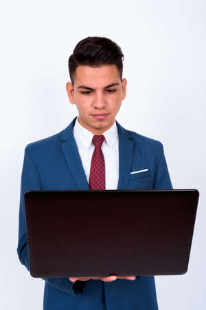 Portrait of young handsome multi ethnic businessman in suitの写真素材