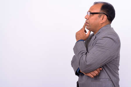 Portrait of mature overweight Indian businessman in suitの写真素材